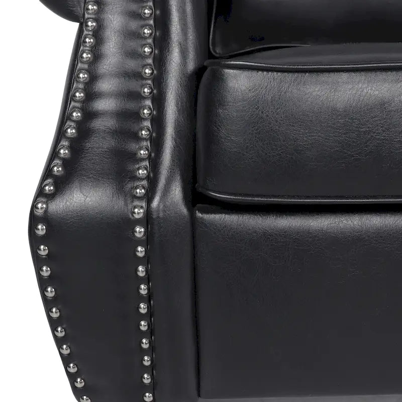 Un canapé trois places en similicuir orné de rivets.